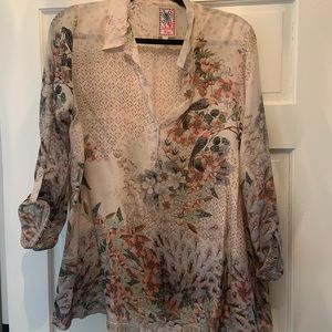 Johnny was silk blouse with birds and flowers.